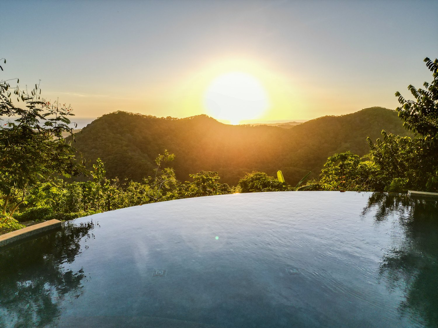 infinite pool, overlooking the sunset.